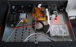 Inside of a custom case with Raspberry Pi, HDD, and DIY audio electronics