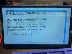 AmigaDOS installation screen with information about a required Workbench 3.0/3.1 disk.