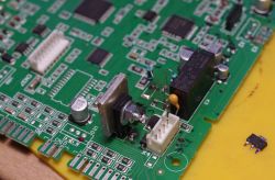 Close-up of a circuit board featuring a modified BD140-16 transistor with an aluminum heatsink.