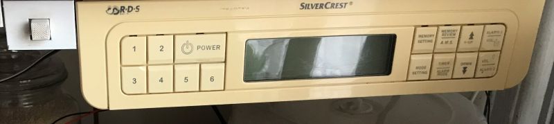 Control panel of a SilverCrest radio with display plus numeric and function buttons