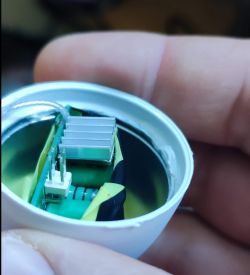 Close-up of the inside of an LED bulb with a small heat sink visible.