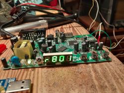 Circuit board with electronic components and LED display showing 1801