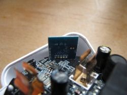 Interior of a Tuya Smart Plug with Module Close-up of the interior of a Tuya smart plug showing the module and components.