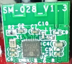Small green printed circuit board labeled SM-028_V1.3 with various components.