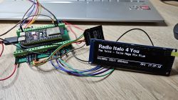 Microcontroller system with display showing radio playback.