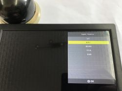 Small monitor screen showing “Input Source” menu with BNC highlighted