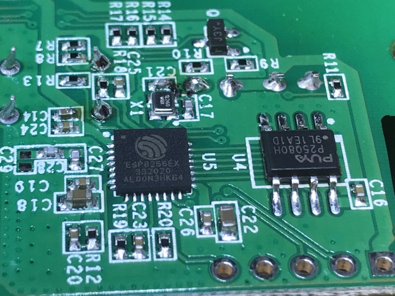 Close-up of ESP8266EX Chip and SPI Memory on Circuit Board Close-up of a circuit board featuring the ESP8266EX chip and Puya P25Q80H SPI memory.