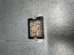 Exposed electronic module with visible circuitry and connector pins